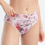 Close up of woman wearing white floral panties