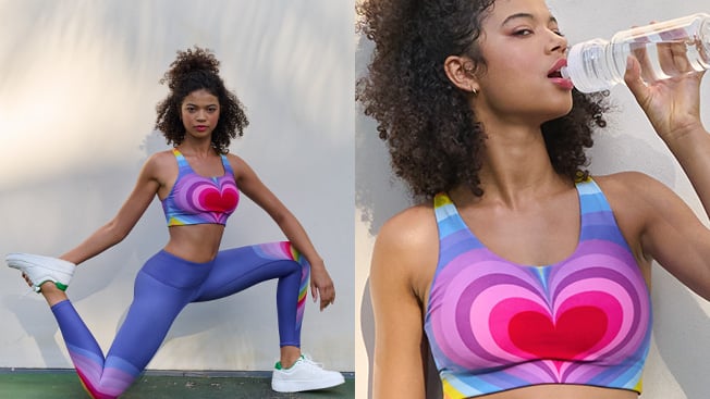 A dipdict of a woman modeling a sports bra with a large heart graphic centered on it, with matching leggings. The left image shows her strecthing while the right image shows her upclose and drinking a bottle of water.